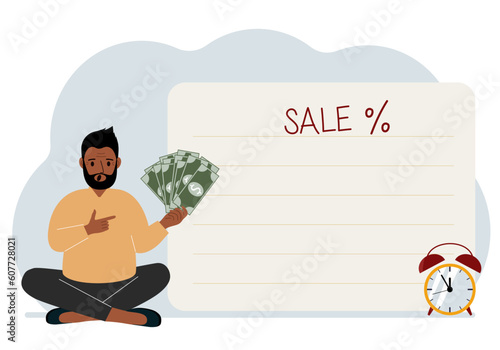 The men sits cross-legged and holds a lot of cash. Nearby is a poster with the text sale and a percent sign. Sale, discount or black friday concept.