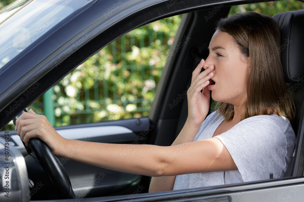 tired beautiful woman driver has sleepy expression tired beautiful woman driver has sleepy expression