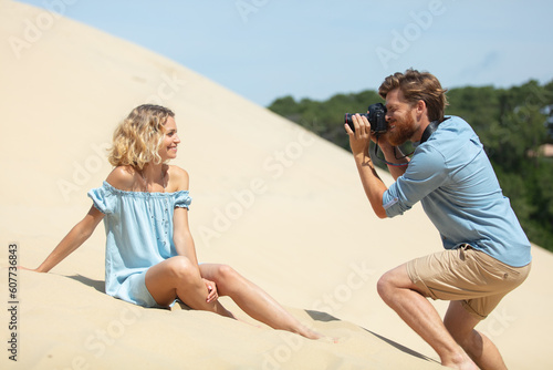 professional photo shooting outdoors on sand dune