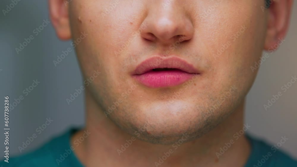 Portrait of Young Man Showing Sign of Close Mouth and Please Shut Up on Camera Close Up. Cropped Face of Real Male Person Signing Stop Talking Symbol in Dangerous Chat. Calm Guy Making Hand Gesture Portrait of Young Man Showing Sign of Close Mouth and Please Shut Up on Camera Close Up. Cropped Face of Real Male Person Signing Stop Talking Symbol in Dangerous Chat. Calm Guy Making Hand Gesture