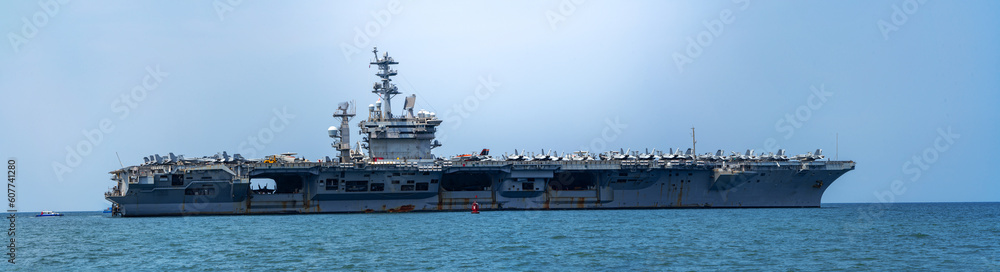 Nuclear WarShip, Military navy ship carrier full loading fighter jet aircraft for prepare troops. forwarder mast. Side view of Navy warship.