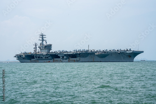 Nuclear War Ship, Military navy ship carrier full loading fighter jet aircraft for prepare troops. forwarder mast. Side view of War Ship.