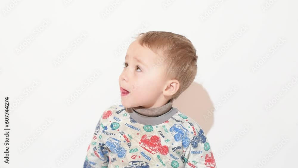 Portrait of curious caucasian fair kid boy on white background, cute boy of 3 years Portrait of curious caucasian fair kid boy on white background, cute boy of 3 years