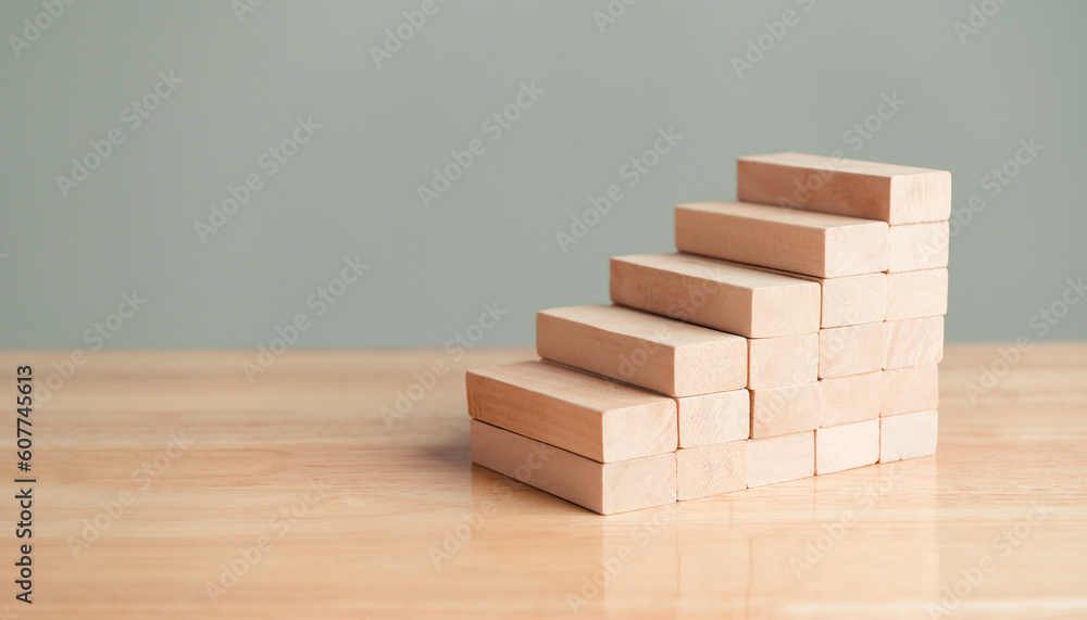Wooden blocks stacking for arrangement and development as stair steps construction shape. Business growth success and Education development practice plan project. Progress and management Wooden blocks stacking for arrangement and development as stair steps construction shape. Business growth success and Education development practice plan project. Progress and management