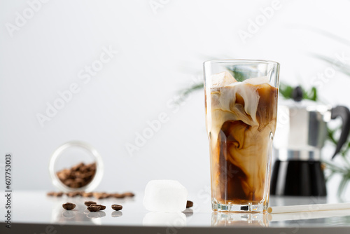 Iced coffee in glass with milk
