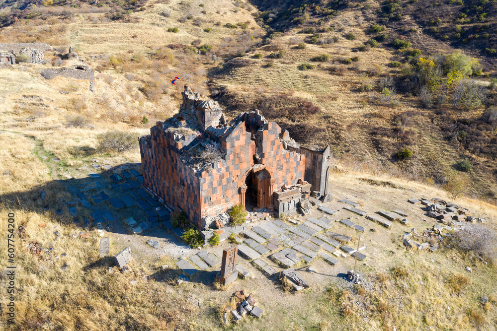 Drone view of remains of Havuts Tar monastery on sunny autumn day. Khosrov Reserve, Armenia.