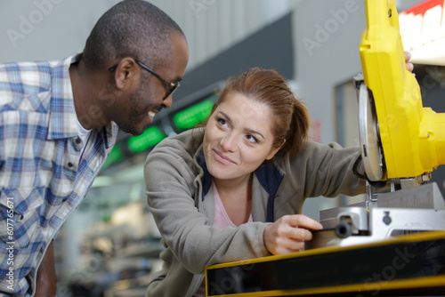 customer looking at mitter saw in hardware store photo