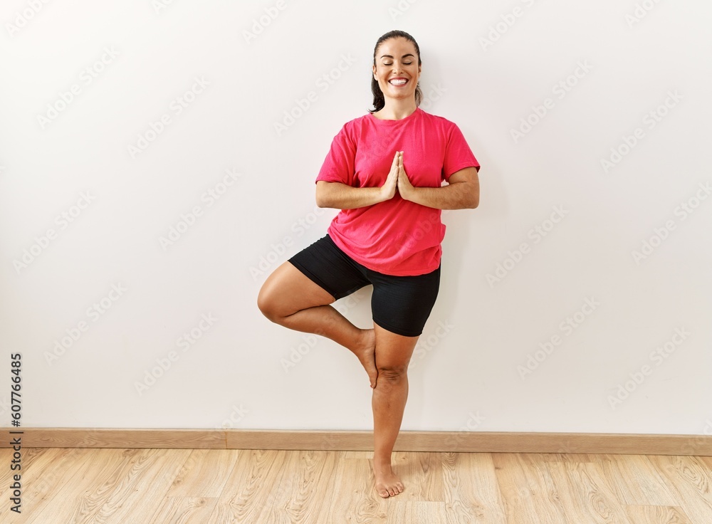 Young beautiful hispanic woman smiling confident training yoga at sport center Young beautiful hispanic woman smiling confident training yoga at sport center