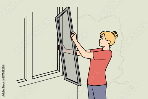 Woman install fly screen on house window. Female put plastic mesh insect screen panel on building. Vector illustration. 