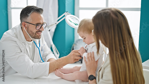 Caucasian mother with baby on a doctor appointment at clinic