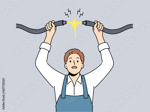 Male electrician in uniform connect cables. Scared mechanic plug join electrical wires. Electricity and power. Vector illustration. 