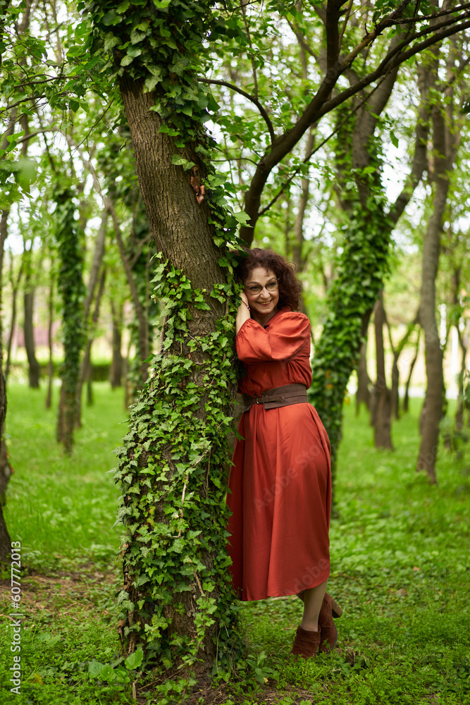 Candid of a mature curly hair redhead woman