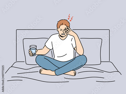 Unhealthy man sit on bed suffer from migraine holding glass of water with pill. Unwell guy struggle with headache from hangover take painkiller medication. Vector illustration. 