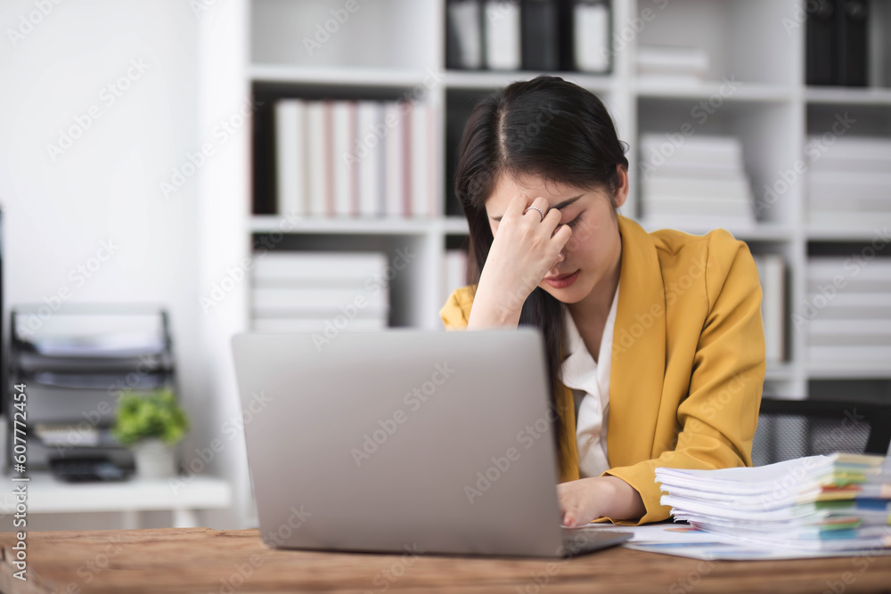 asian business woman thinking solving problem at work, worried serious young asian woman concerned make difficult decision lost in thought reflecting sit with laptop. asian business woman thinking solving problem at work, worried serious young asian woman concerned make difficult decision lost in thought reflecting sit with laptop.
