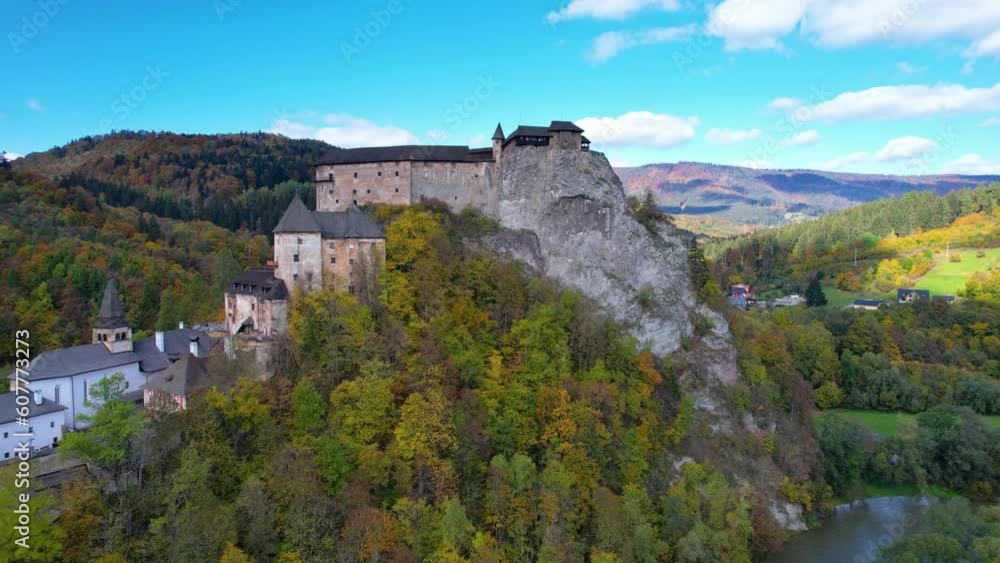 Orava castle or Oravsky Hrad in Slovakia. Medieval high and steep cliff by the Orava River. Autumn sunny day. Orava castle or Oravsky Hrad in Slovakia. Medieval high and steep cliff by the Orava River. Autumn sunny day.