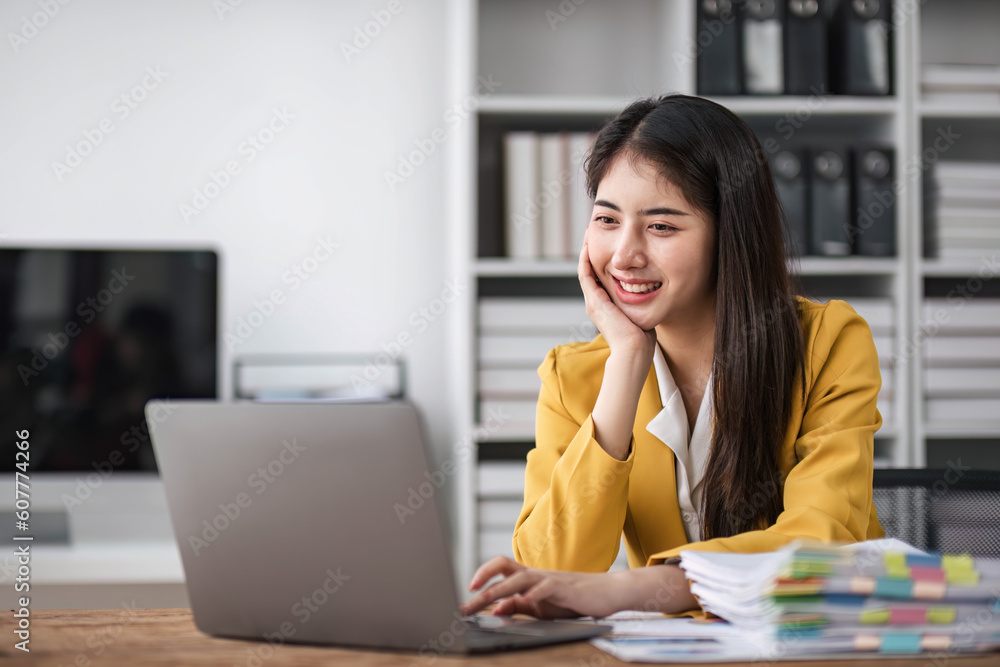 asian business woman thinking solving problem at work, worried serious young asian woman concerned make difficult decision lost in thought reflecting sit with laptop. asian business woman thinking solving problem at work, worried serious young asian woman concerned make difficult decision lost in thought reflecting sit with laptop.