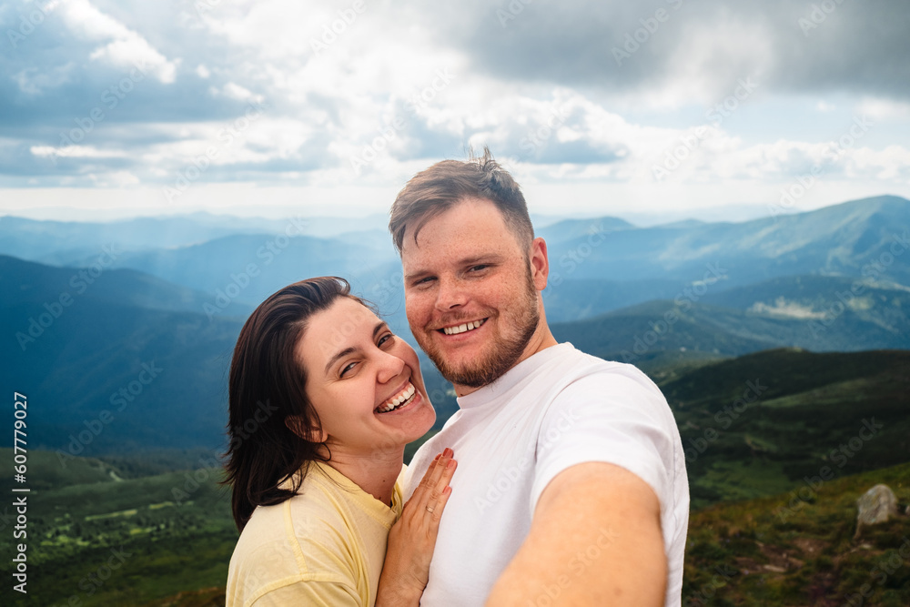 A happy couple on the mountain