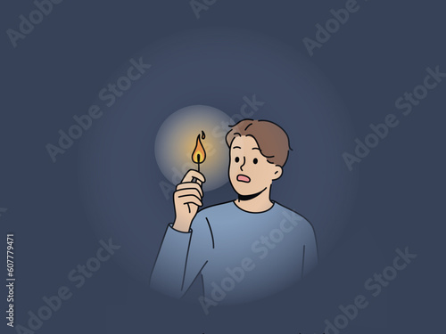 Scared man in darkness with lit match. Terrified guy with light walking in dark. Electricity lack. Vector illustration. 