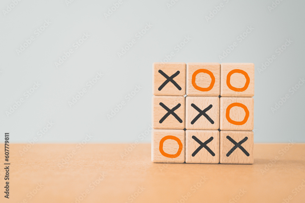 Business marketing strategy planning concept. Wooden block tic tac toe board game including copy space Business marketing strategy planning concept. Wooden block tic tac toe board game including copy space