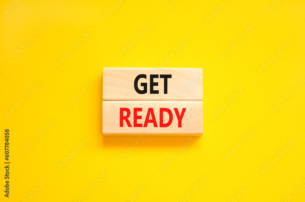 Get ready symbol. Concept words Get ready on wooden blocks on a beautiful yellow table yellow background. Business, support, motivation and get ready concept. Copy space. Get ready symbol. Concept words Get ready on wooden blocks on a beautiful yellow table yellow background. Business, support, motivation and get ready concept. Copy space.