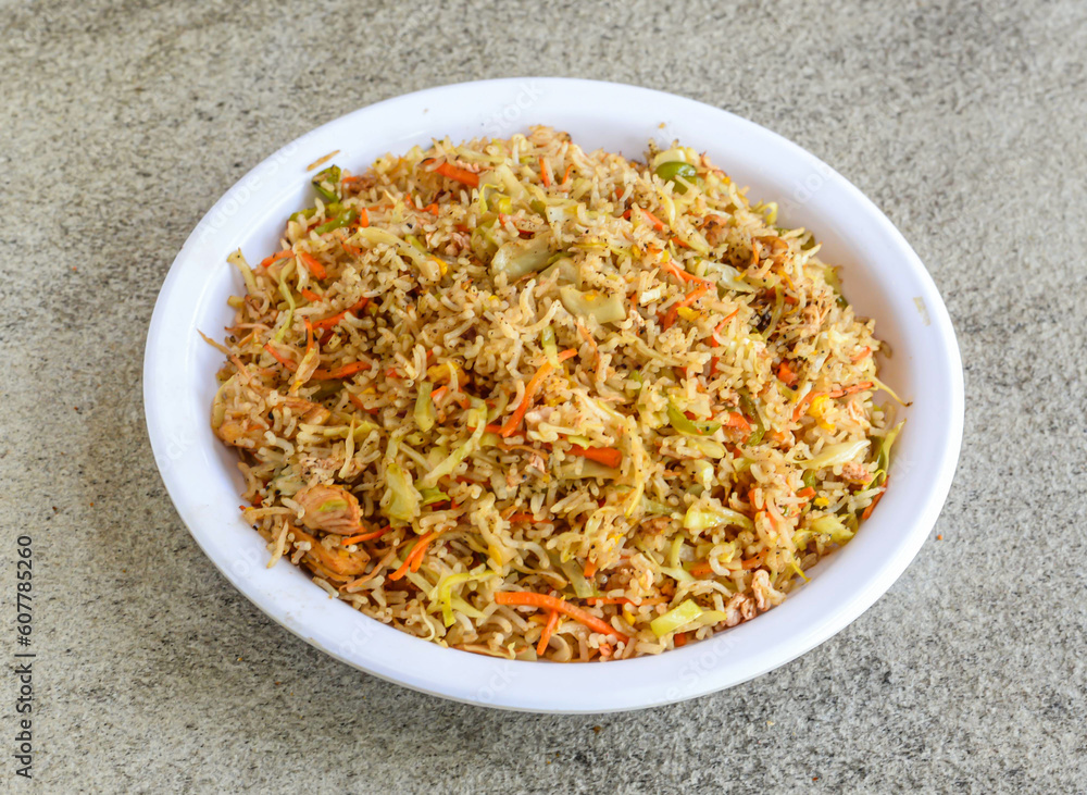 chicken fried rice served in plate isolated on grey background top view of pakistani and indian spices food chicken fried rice served in plate isolated on grey background top view of pakistani and indian spices food