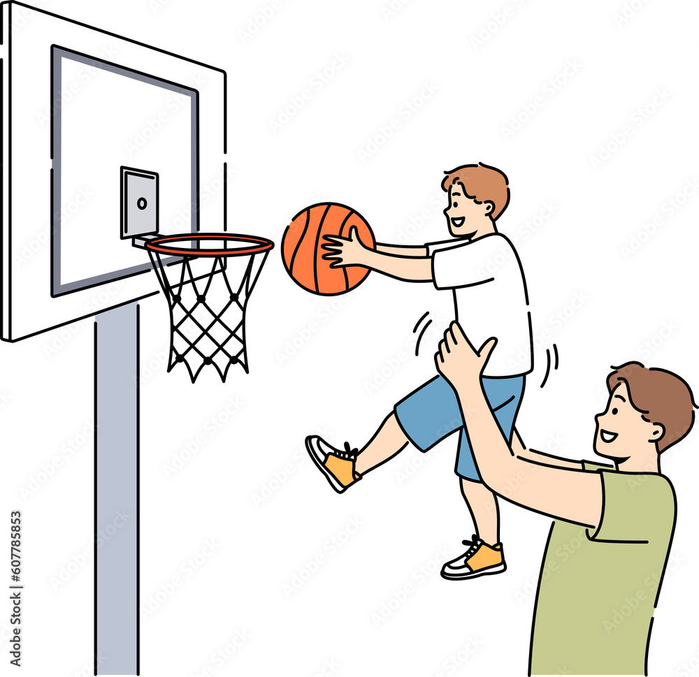Smiling father play basketball with son