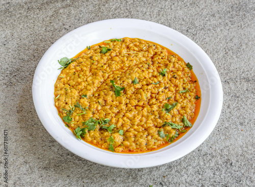 daal mash fried served in plate isolated on grey background top view of pakistani and indian spices food photo