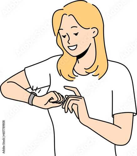 Smiling woman check time on wristwatch