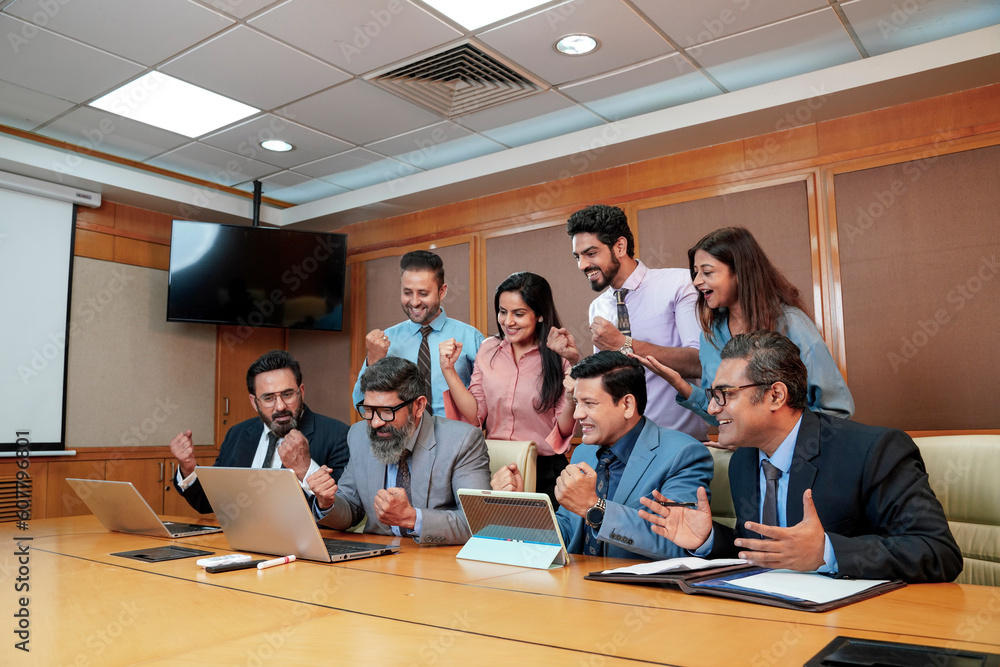 Indian businesspeople group celebrate after dealing feel happy and signing contract or agreement at meeting room Indian businesspeople group celebrate after dealing feel happy and signing contract or agreement at meeting room