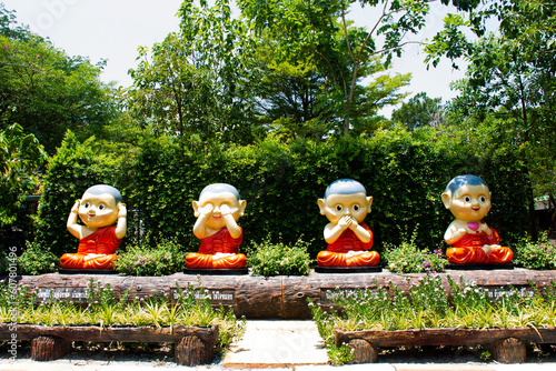 Four wise novices statue for thai people and foreign travelers visit travel in garden park of Wat Don Khanak temple at Nakhonpathom city  on May 18, 2023 in Nakhon Pathom, Thailand photo