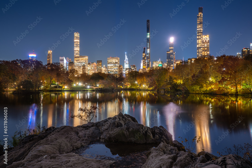 Billionaires' Row skyscrapers from Central Park Lake at night. Manhattan, New York City