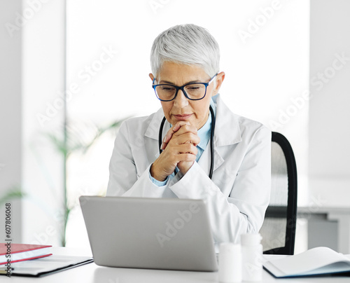 doctor senior laptop woman medical hospital care health clinic elderly mature caucasian female happy healthcare glasses office confident medicine occupation