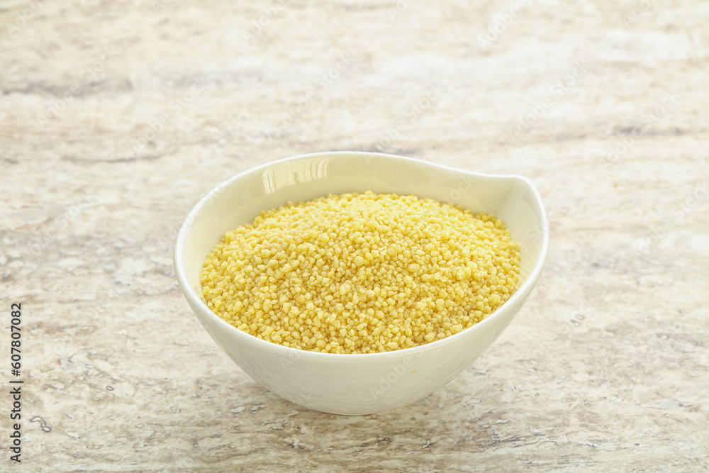 Raw couscous in the bowl Raw couscous in the bowl