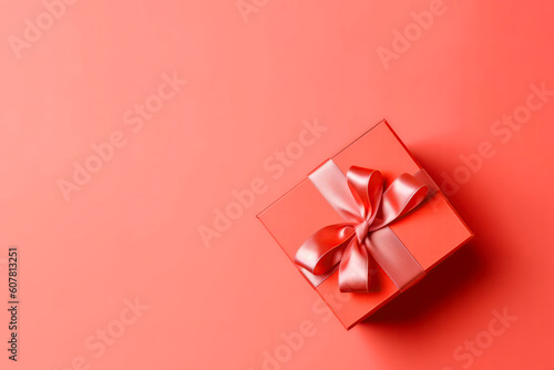 Wallpaper Mural Box With Bow On Coral Color Background, Top View, Copy Space. Celebrating Valentine's Day, Birthdays, Christmas. Generative AI Torontodigital.ca