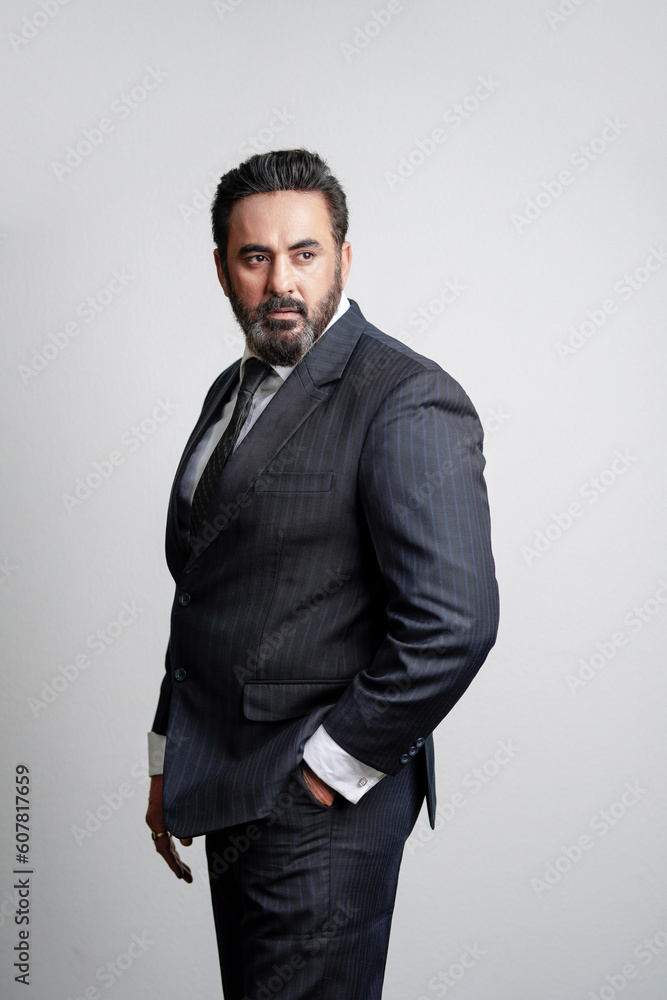 Fototapeta premium Indian corporate or businessman giving expression on white background.