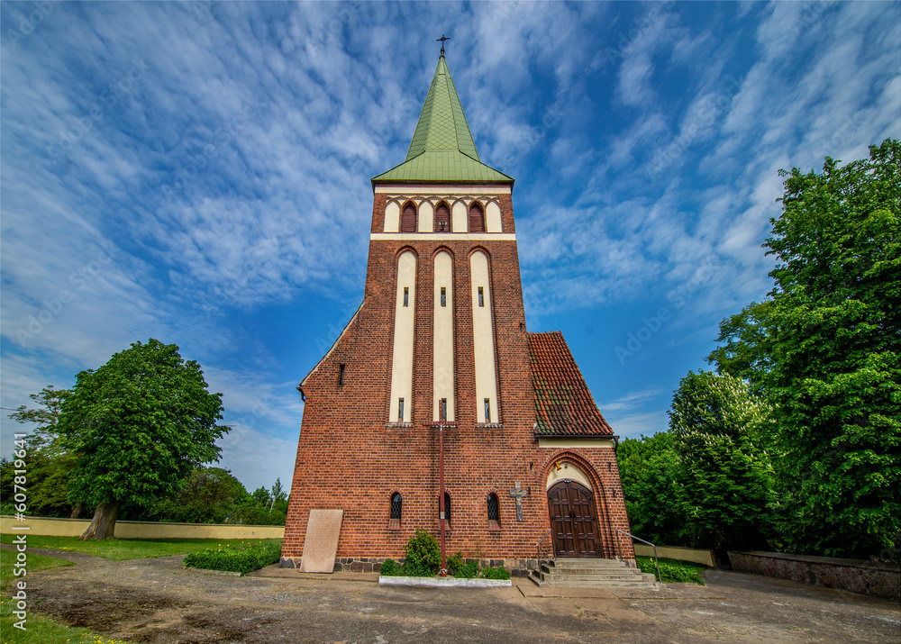 General view and close-up of architectural details of the St. Anthony of Padua Catholic Church built in 1911 in Sarnowo, Masuria, Poland.