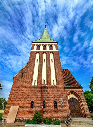 Fototapeta Naklejka Na Ścianę i Meble -  General view and close-up of architectural details of the St. Anthony of Padua Catholic Church built in 1911 in Sarnowo, Masuria, Poland.