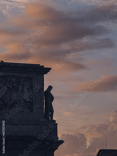 Roman ruins triumph arch in Rome, Italy, with sunset sky