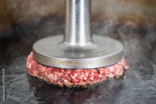 Preparing Burger Patties on the Grill Using Burger Smasher