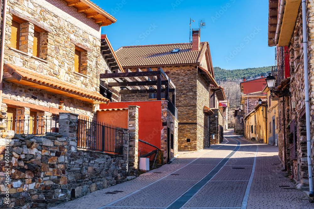Picturesque alley formed by stone houses in the mountain of the Sierra de Madrid, Puebla de la Sierra.