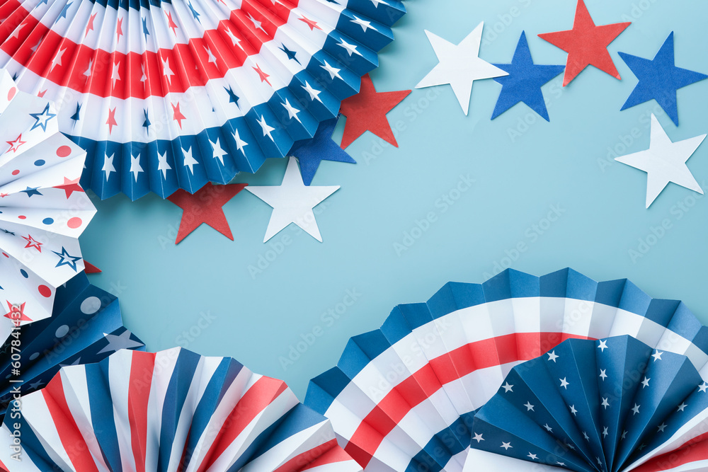 Fototapeta premium 4th of July background. USA paper fans, Red, blue, white stars and confetti on blue wall background. Happy Labor Day, Independence Day, Presidents Day. American flag colors. Mock up. Top view.