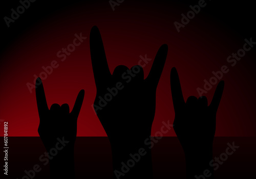  Concierto de rock y manos alzadas con el símbolo del rock sobre fondo degradado rojo negro. Día mundial del rock