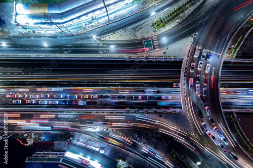 Expressway top view, Road traffic an important infrastructure, Drone aerial view fly in circle, traffic transportation, Public transport or commuter city life concept of economic and energ, transport. © suriyapong