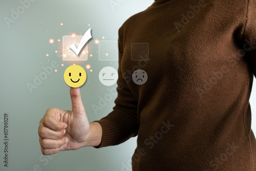 Customer satisfaction concept, thumbs up rating on smiley face icon, giving the highest score, very happy and satisfied with excellent service, feedback from guest.