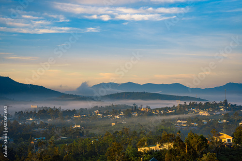 Mountains during dawn. Beautiful natural landscape in the summer time with fog © Quang Ho