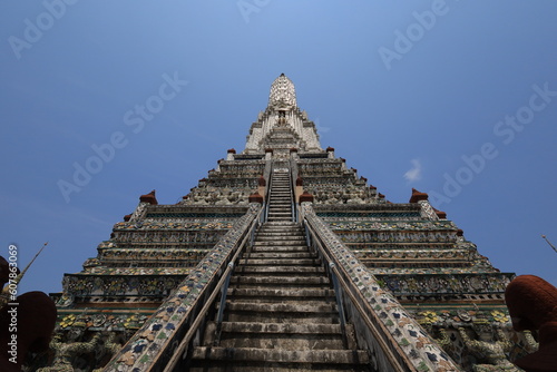 Wat Arun  seen from the bottom up  sees the blue sky. Wat Arun is an iconic landmark of Bangkok  Thailand.