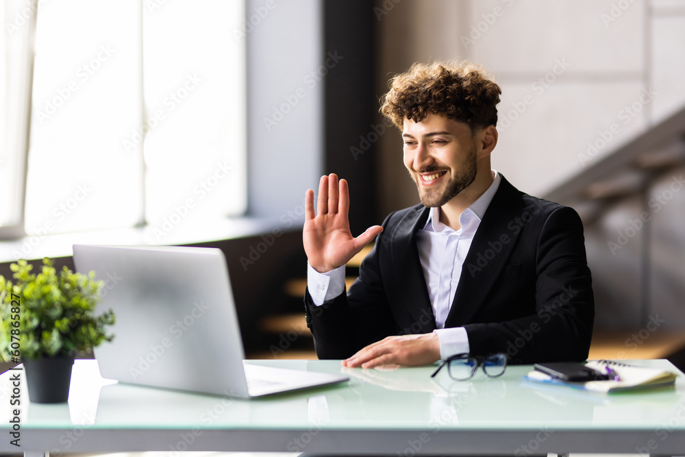 Portrait of a cheerful man having video call on laptop Portrait of a cheerful man having video call on laptop