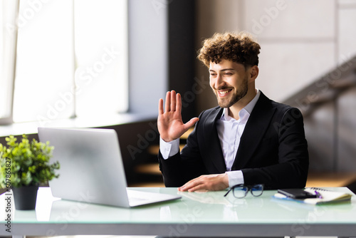 Portrait of a cheerful man having video call on laptop
