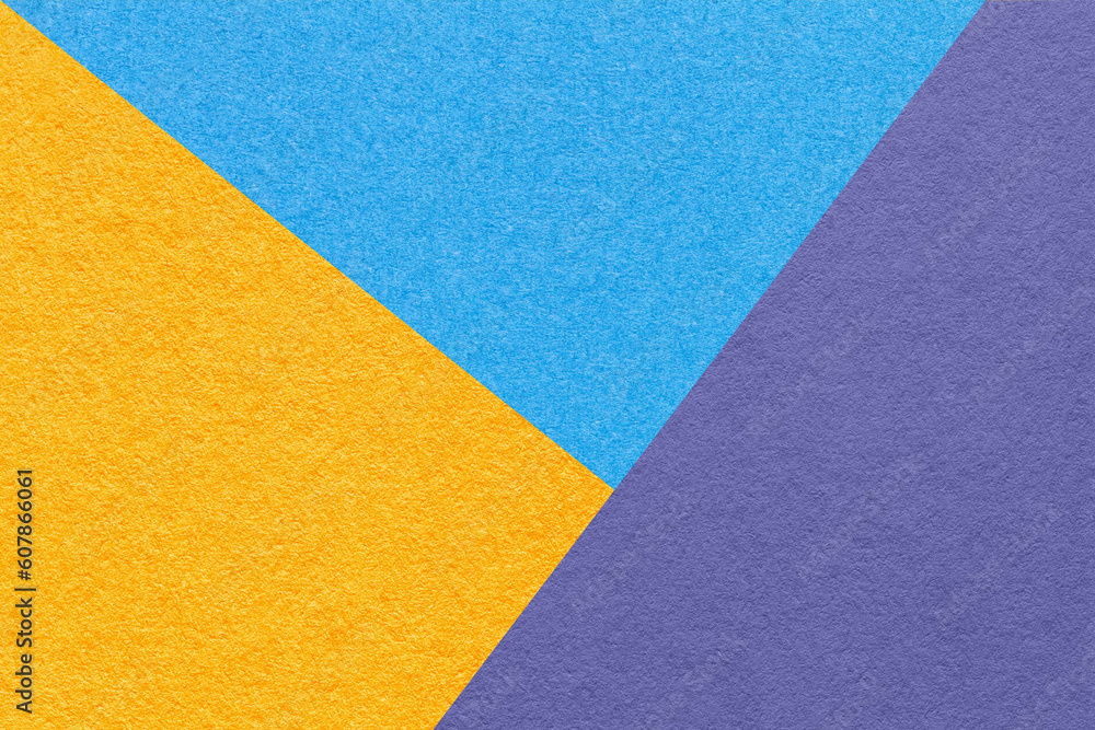 Texture of craft blue, yellow and violet shade color paper background, macro. Structure of vintage abstract cardboard Texture of craft blue, yellow and violet shade color paper background, macro. Structure of vintage abstract cardboard
