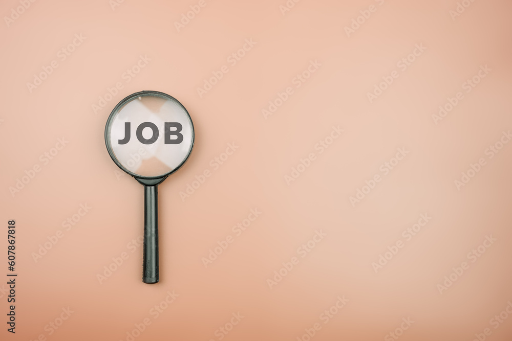 Top view of magnifying glass with job lettering inside. Job search concept. Searching for a hiring Top view of magnifying glass with job lettering inside. Job search concept. Searching for a hiring